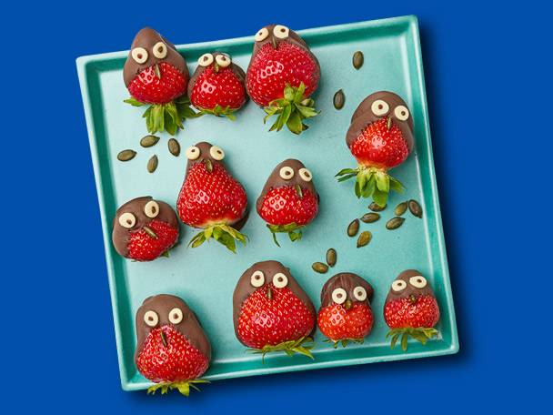 Chocolate-covered strawberries shaped like birds.