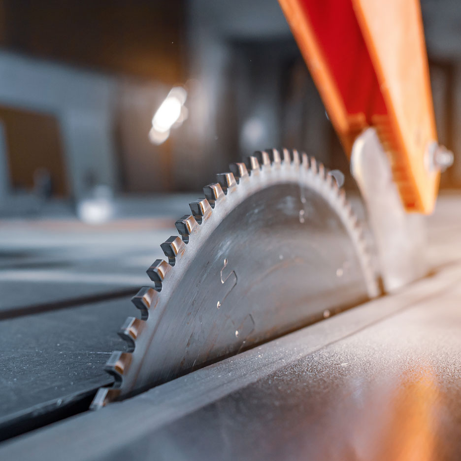 Close-up of a circular saw blade with sharp teeth, ready for woodworking.