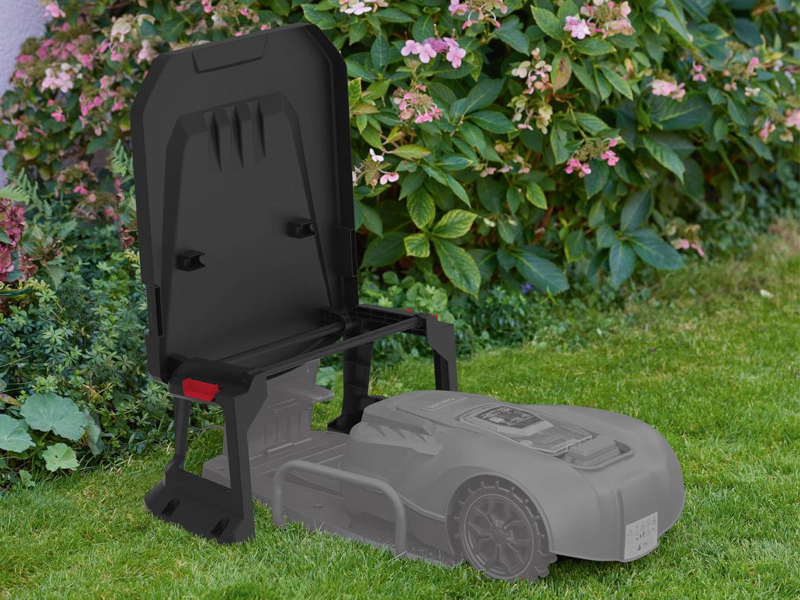 Robot lawnmower in its storage box.