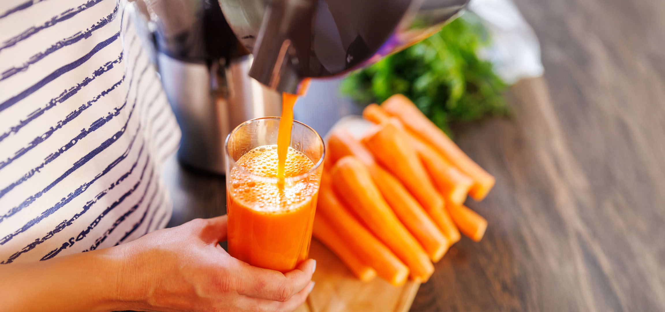 Freshly squeezed carrot juice in a glass.