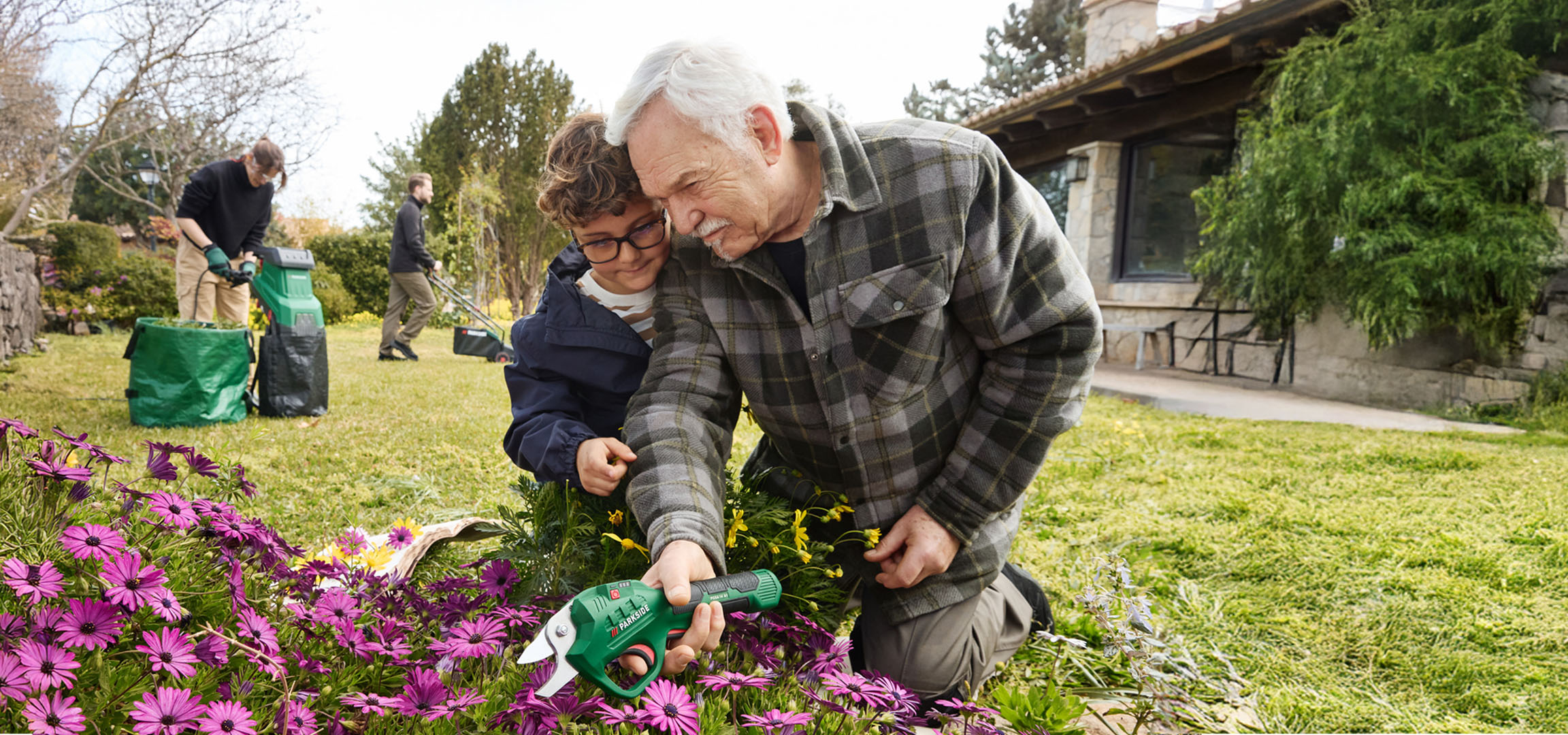 Gardening with Parkside electric shears and people in a garden.