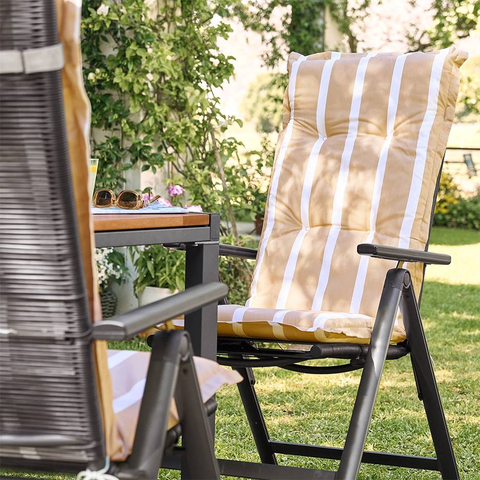 Folding garden chairs with striped cushions.