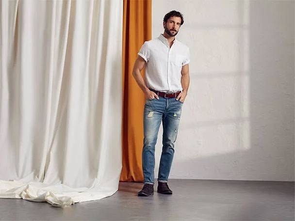 Man in white shirt and jeans