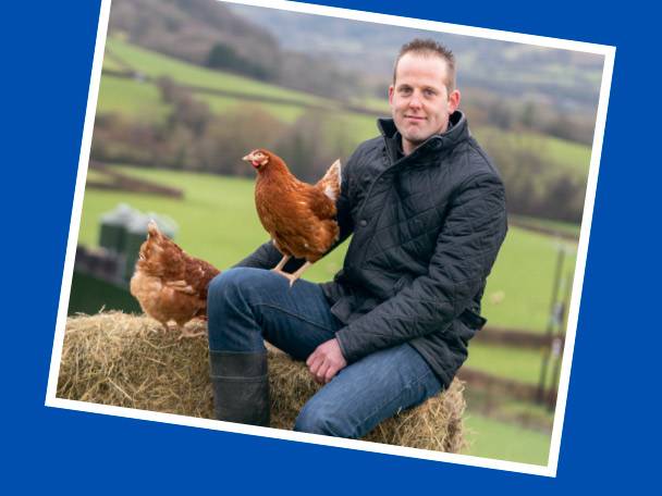 Chickens and farmer in a rural setting.