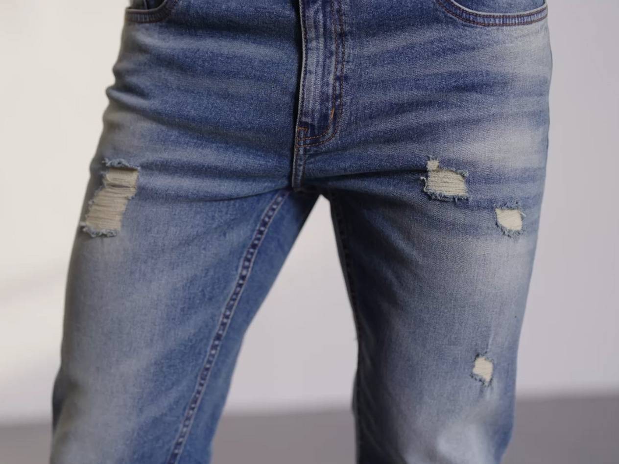 Distressed denim jeans.