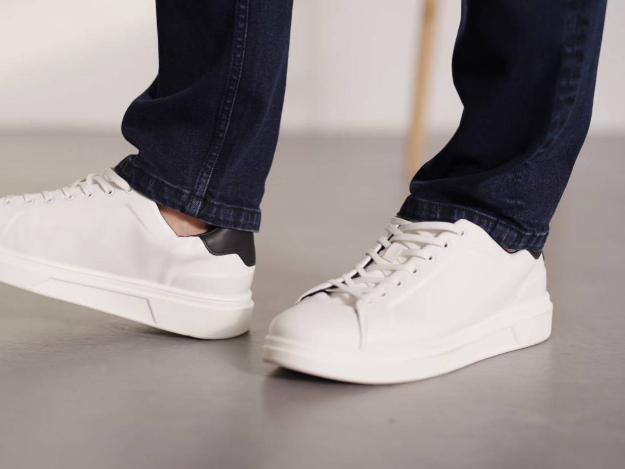 White sneakers and blue jeans.