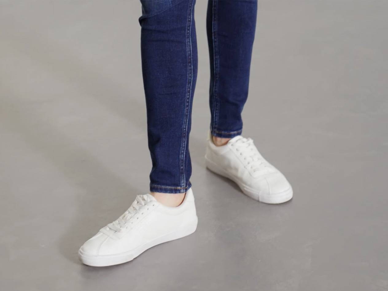 Jeans and white sneakers.