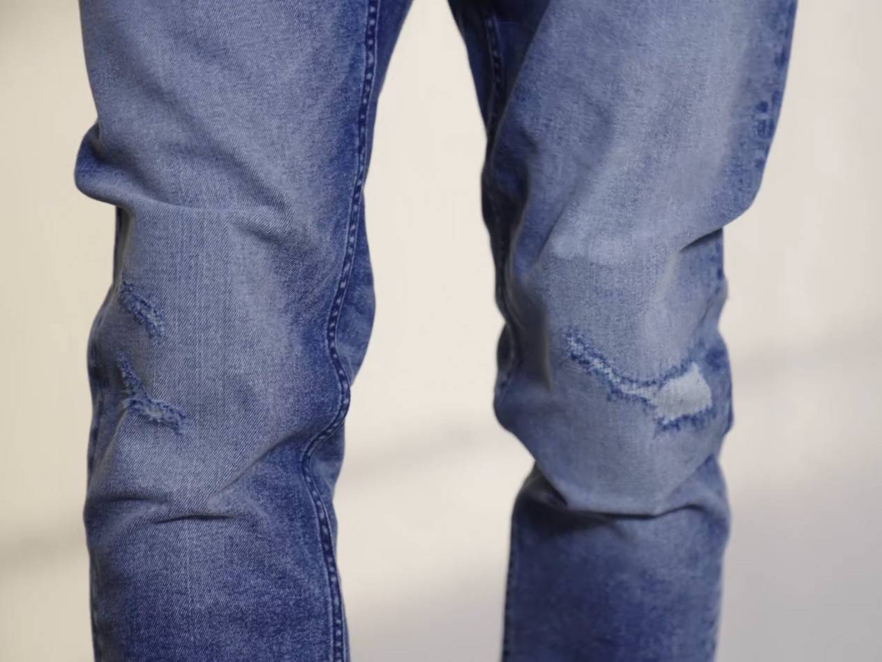 Distressed denim jeans.